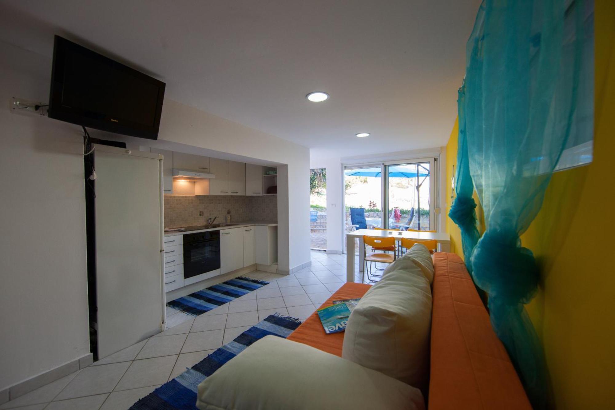 The Sea House Apartments Vis Bilik gambar